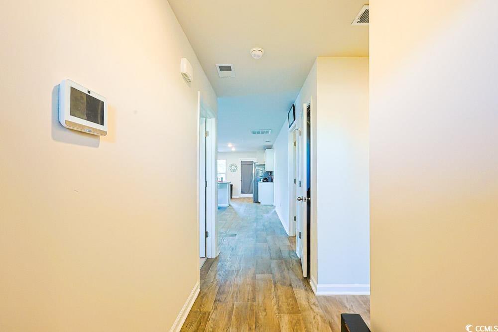 224 Jeff Waters Circle Longs, SC 29568 - Photo 22 of 30 Corridor with light wood finished floors and baseboards