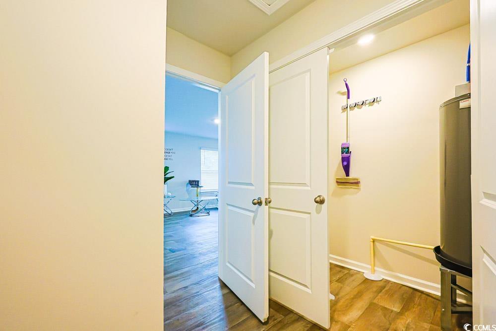 224 Jeff Waters Circle Longs, SC 29568 - Photo 23 of 30 Corridor featuring wood finished floors and water heater