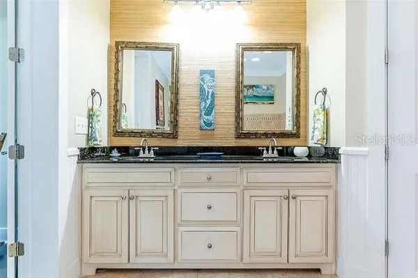 a view of two mirror and a sink