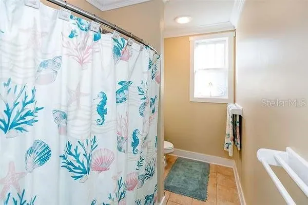 a bathroom with a bathtub and shower curtain