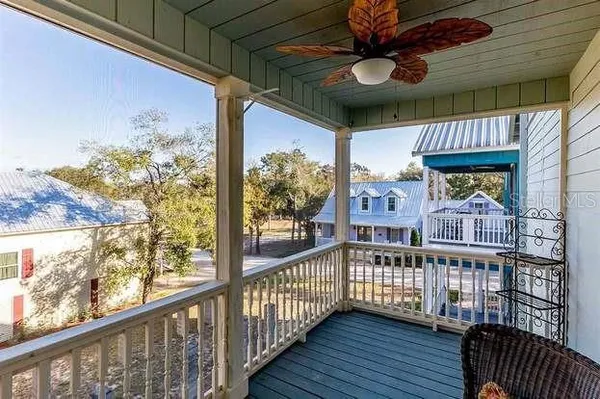 a view of a balcony with furniture
