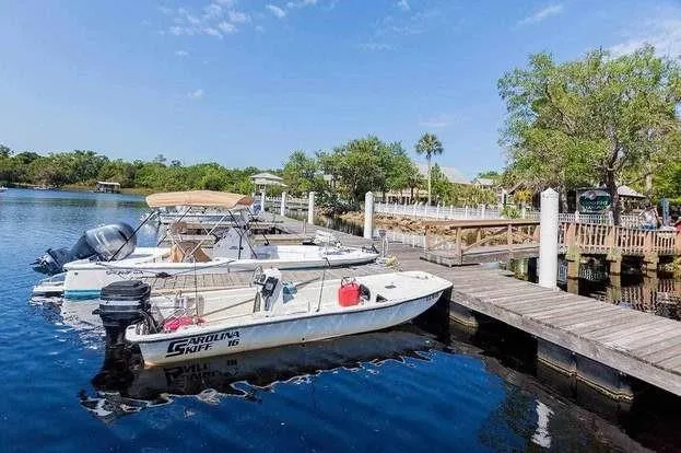 a view of houses with outdoor seating and lake view