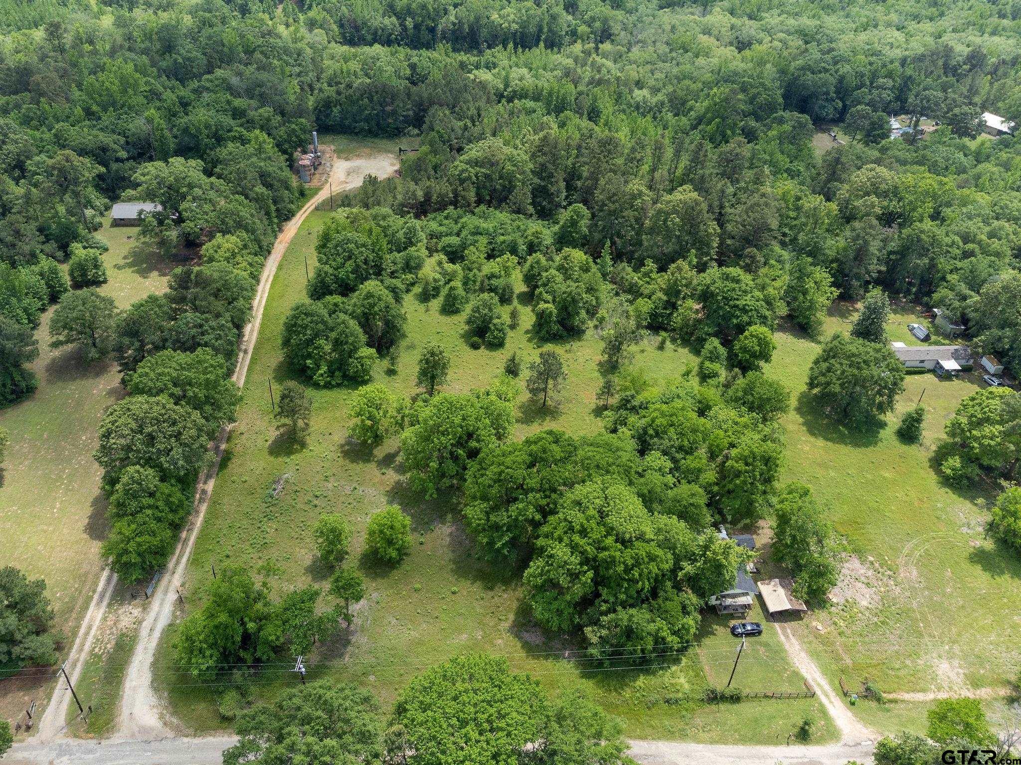 2255 Tyler Tx 75708 Tyler, TX 75708 - Photo 12 of 16 an aerial view of residential house with outdoor space and trees all around