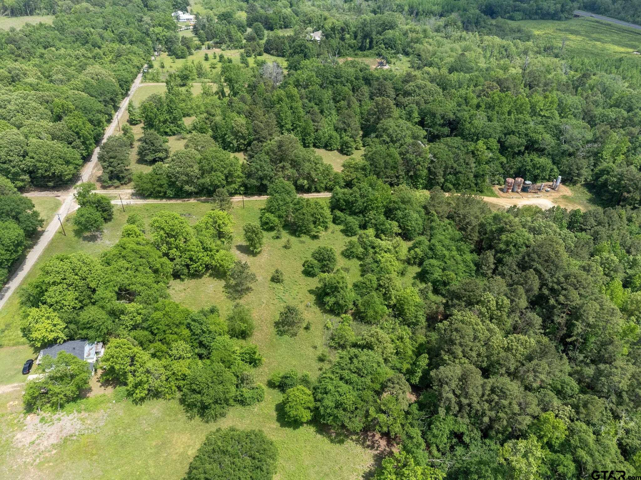 2255 Tyler Tx 75708 Tyler, TX 75708 - Photo 13 of 16 an aerial view of residential house with outdoor space and trees all around