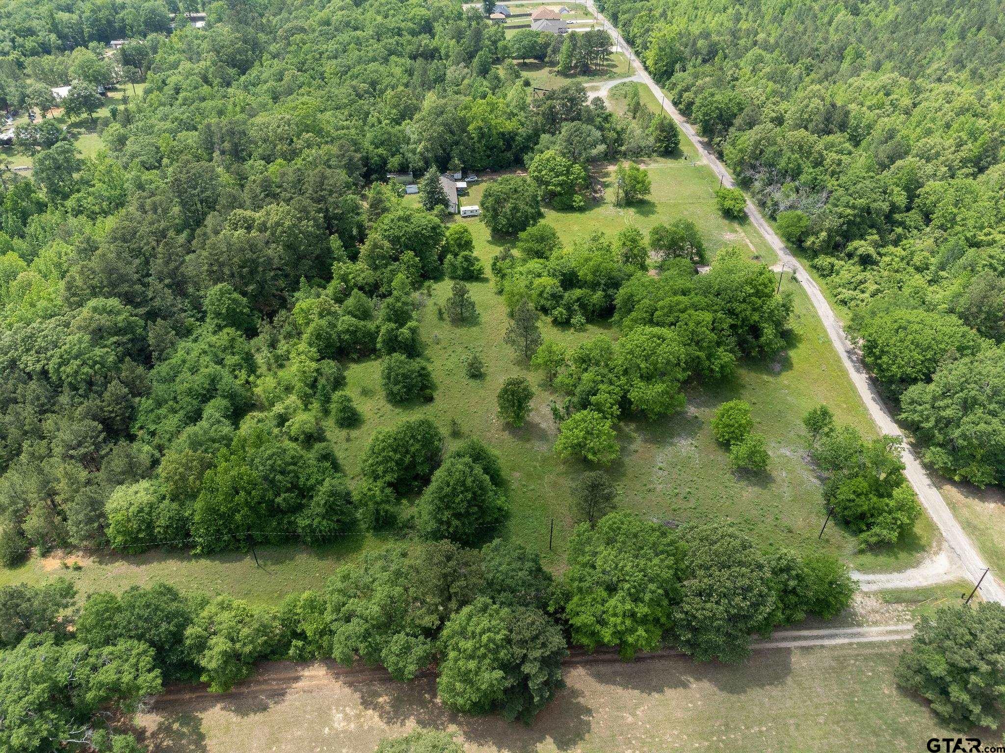 2255 Tyler Tx 75708 Tyler, TX 75708 - Photo 14 of 16 an aerial view of a house with a yard