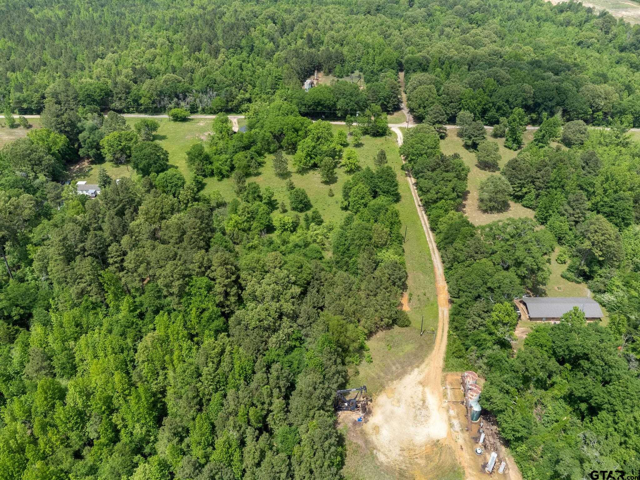 2255 Tyler Tx 75708 Tyler, TX 75708 - Photo 15 of 16 an aerial view of residential house with outdoor space and trees all around