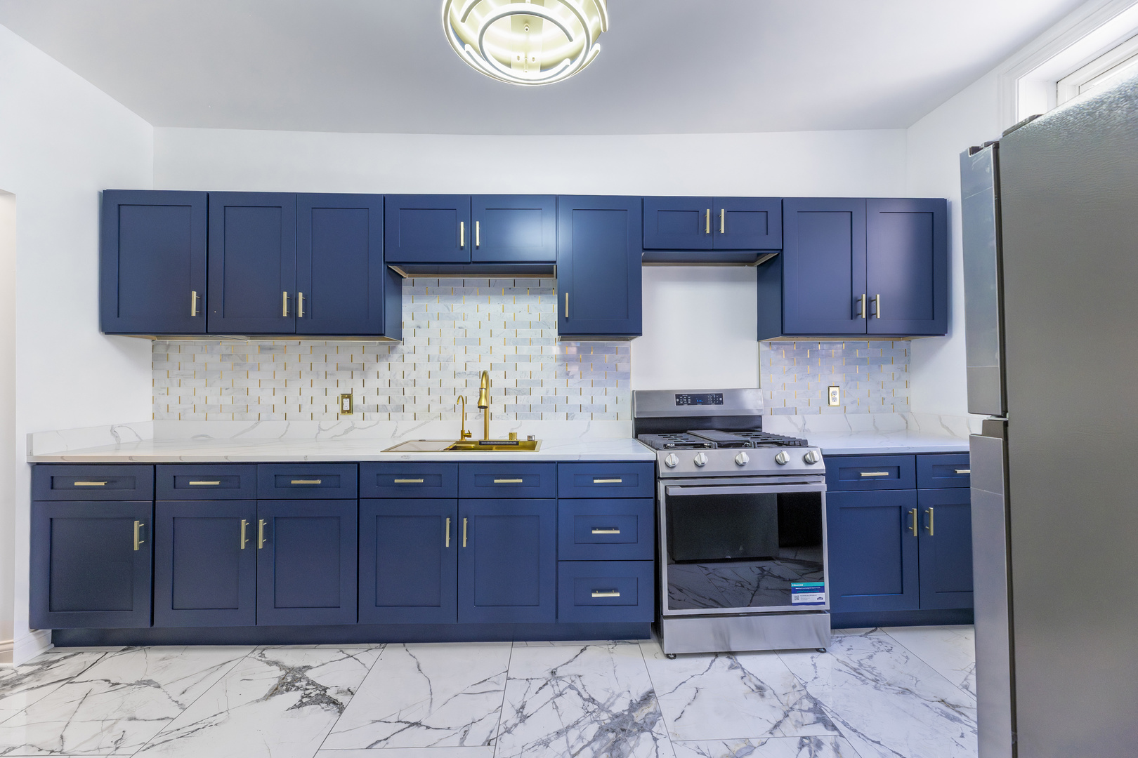 4722 South Ingleside Avenue, Unit 3N Chicago, IL 60615 - Photo 7 of 12 a kitchen with stainless steel appliances granite countertop a stove and a sink