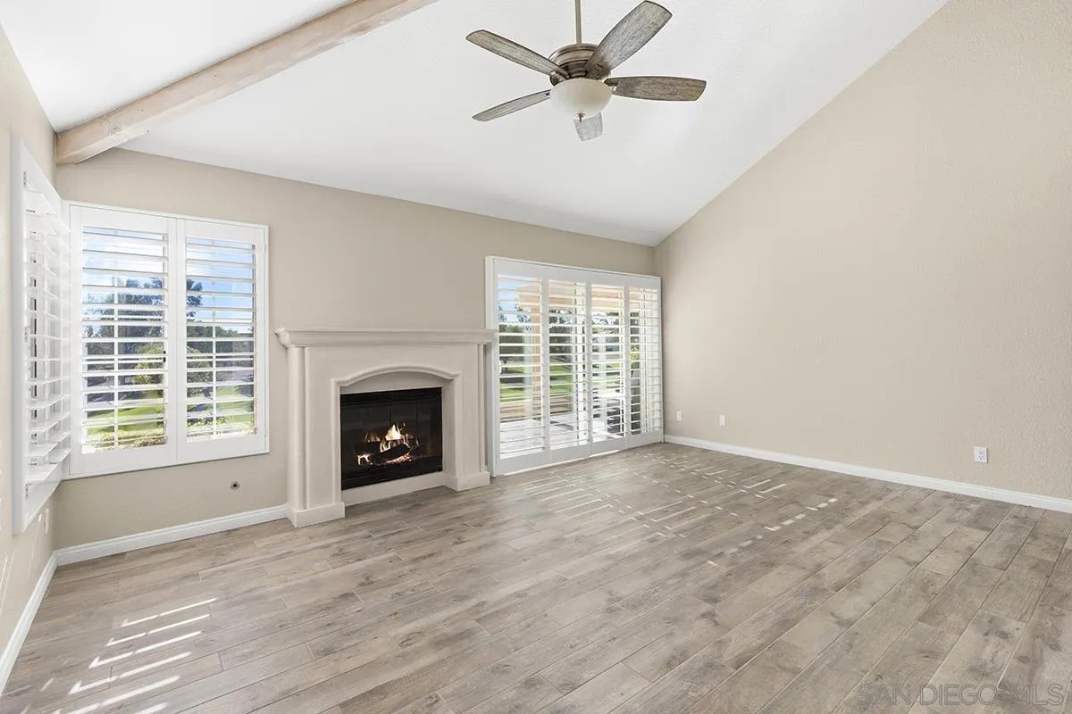 12071 Caminito Corriente San Diego, CA 92128 - Photo 21 of 51 a view of a livingroom with a fireplace and window