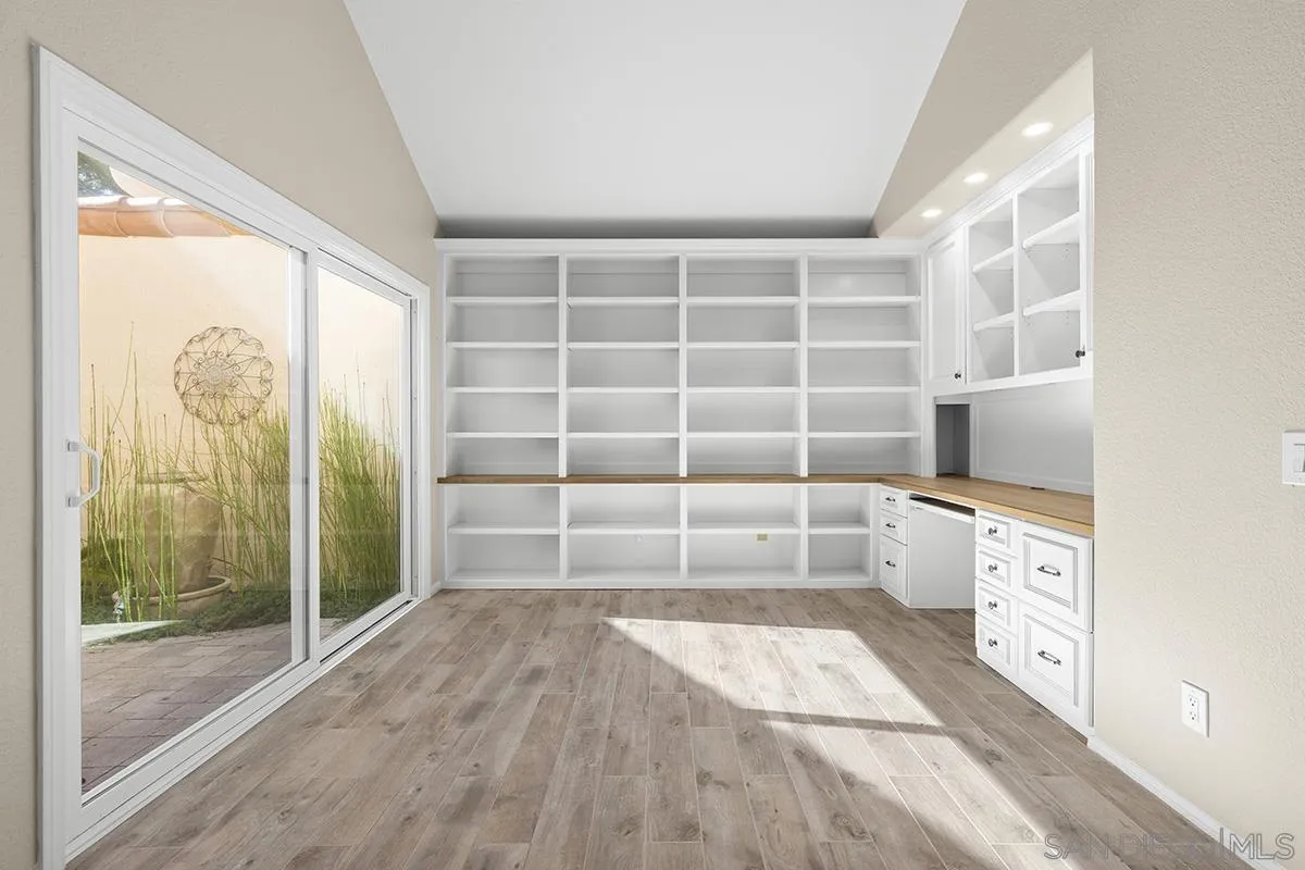 12071 Caminito Corriente San Diego, CA 92128 - Photo 27 of 51 a view of a walk in closet with empty racks