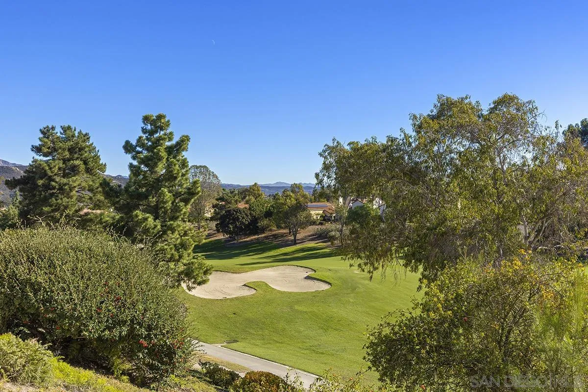 12071 Caminito Corriente San Diego, CA 92128 - Photo 40 of 51 a view of a lake with a yard
