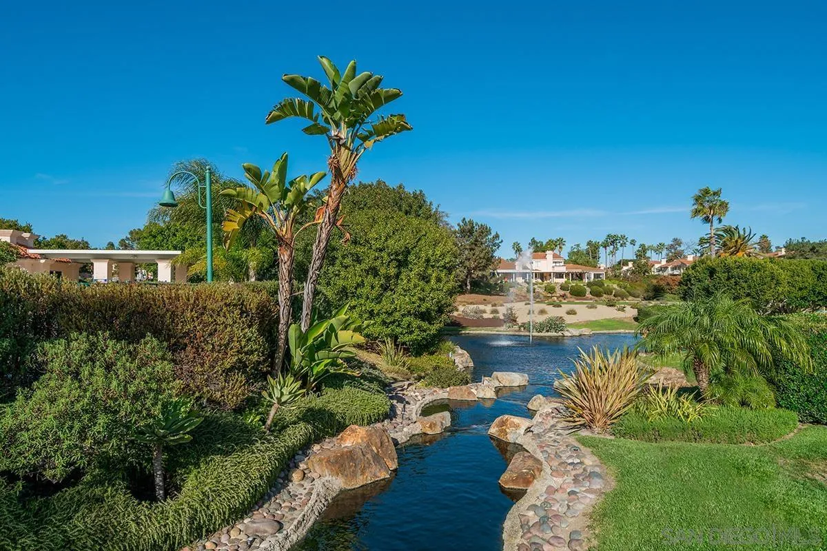 12071 Caminito Corriente San Diego, CA 92128 - Photo 47 of 51 a view of a lake with a building in the background