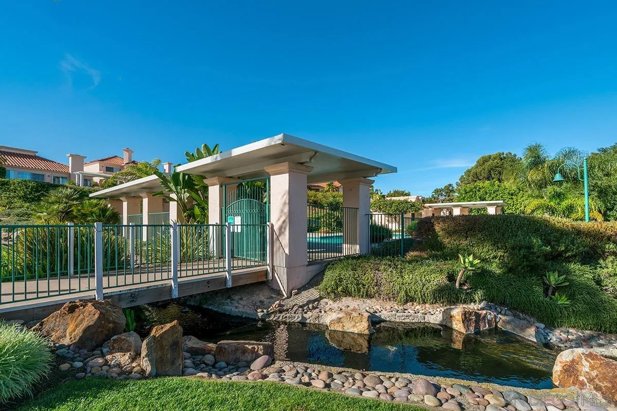 12071 Caminito Corriente San Diego, CA 92128 - Photo 49 of 51 a front view of a house with a garden