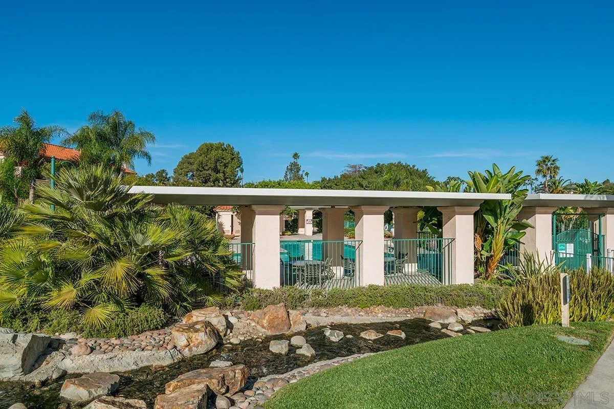 12071 Caminito Corriente San Diego, CA 92128 - Photo 50 of 51 a front view of a house with a yard