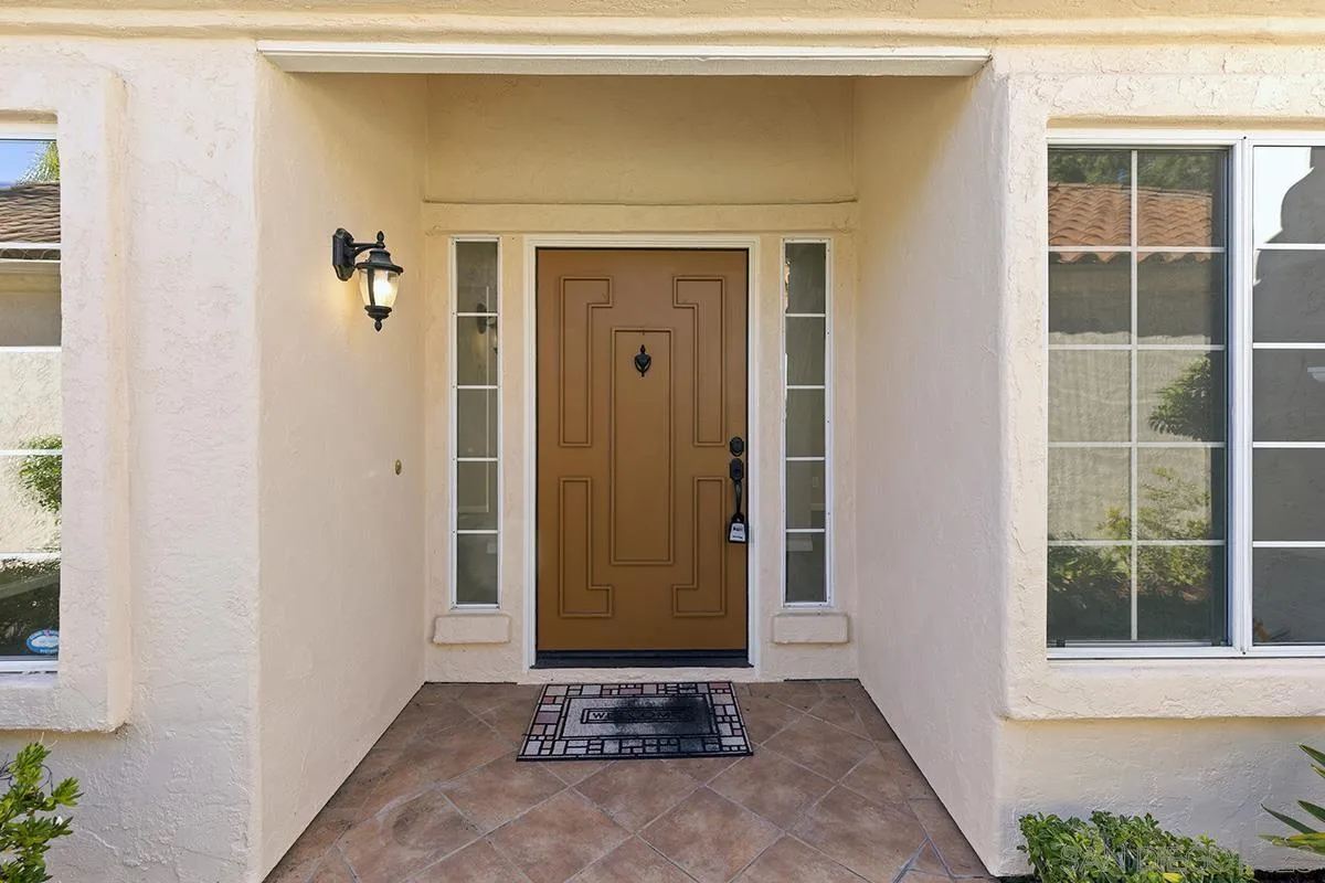 12071 Caminito Corriente San Diego, CA 92128 - Photo 5 of 51 a view of front door of a house