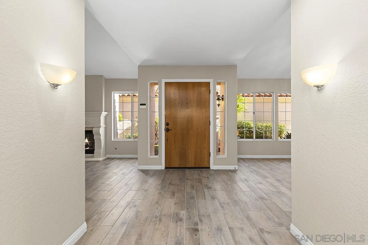 12071 Caminito Corriente San Diego, CA 92128 - Photo 6 of 51 a view of a hallway with wooden floor