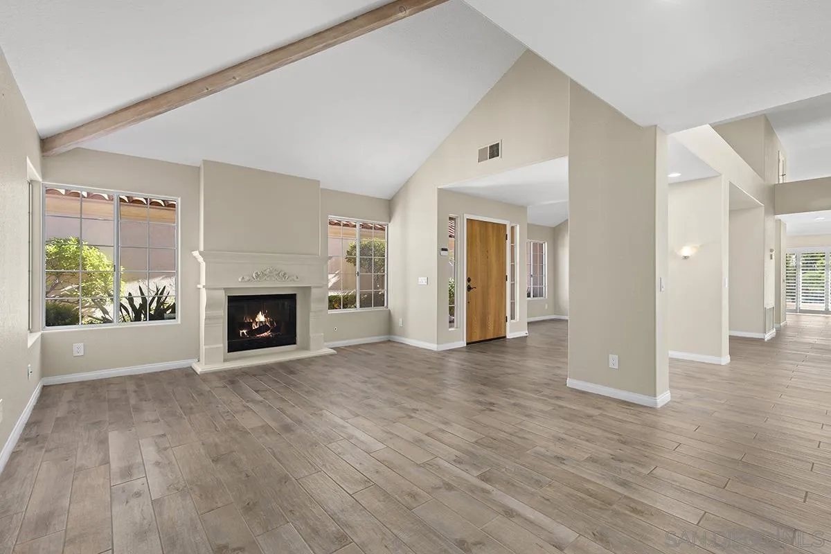 12071 Caminito Corriente San Diego, CA 92128 - Photo 8 of 51 a view of a livingroom with a fireplace
