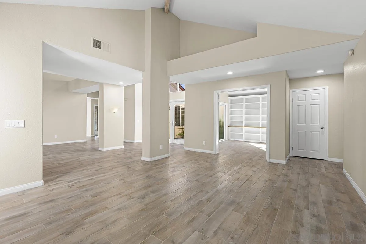 12071 Caminito Corriente San Diego, CA 92128 - Photo 10 of 51 wooden floor in an empty room with a window