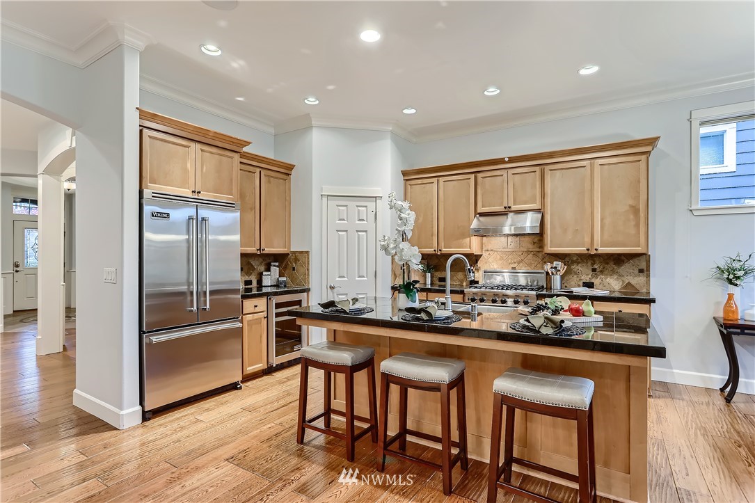 905 South 38th Court Renton, WA 98055 - Photo 14 of 33 a kitchen with stainless steel appliances granite countertop counter space a sink and cabinets