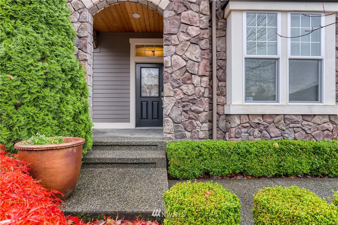 905 South 38th Court Renton, WA 98055 - Photo 3 of 33 a front view of a house with a garden