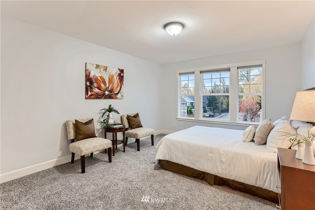 905 South 38th Court Renton, WA 98055 - Photo 24 of 33 a bedroom with a bed and a couch