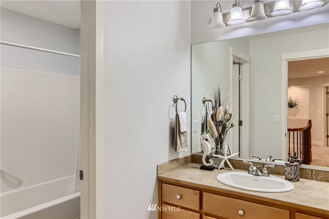 905 South 38th Court Renton, WA 98055 - Photo 25 of 33 a bathroom with a sink and a mirror