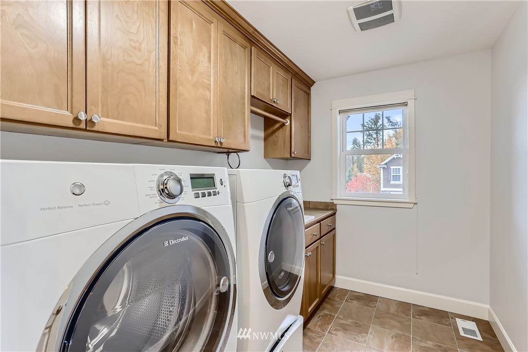 905 South 38th Court Renton, WA 98055 - Photo 29 of 33 a storage room with washer and dryer