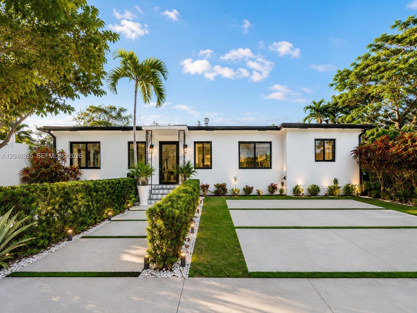375 Southwest 32nd Road Miami, FL 33129 - Photo 13 of 44 a front view of house with yard and green space