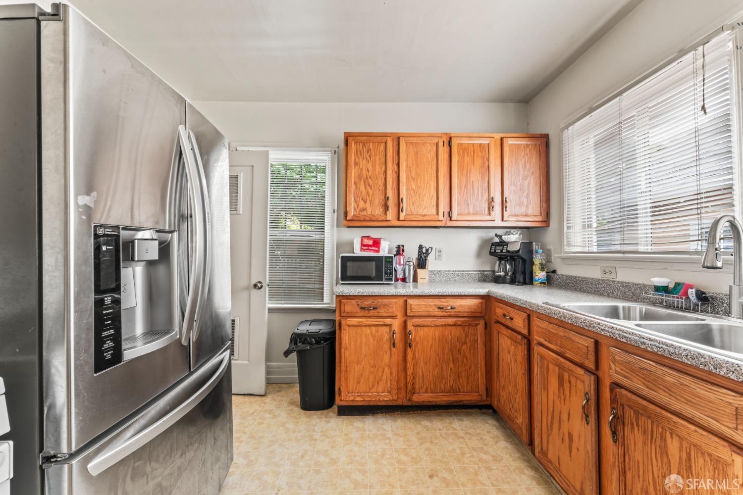 1646 Parker Street Berkeley, CA 94703 - Photo 11 of 33 a kitchen with stainless steel appliances granite countertop a refrigerator and sink