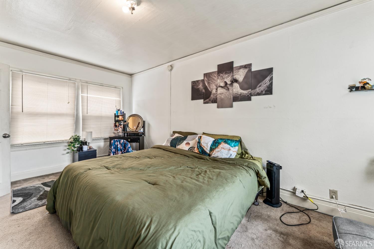 1646 Parker Street Berkeley, CA 94703 - Photo 19 of 33 a bedroom with a bed and window