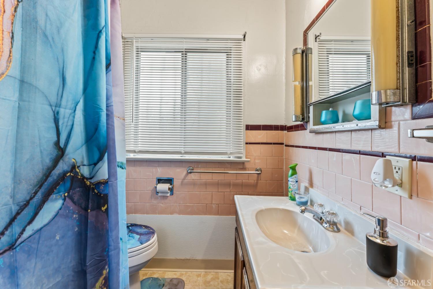 1646 Parker Street Berkeley, CA 94703 - Photo 22 of 33 a bathroom with a sink and a mirror