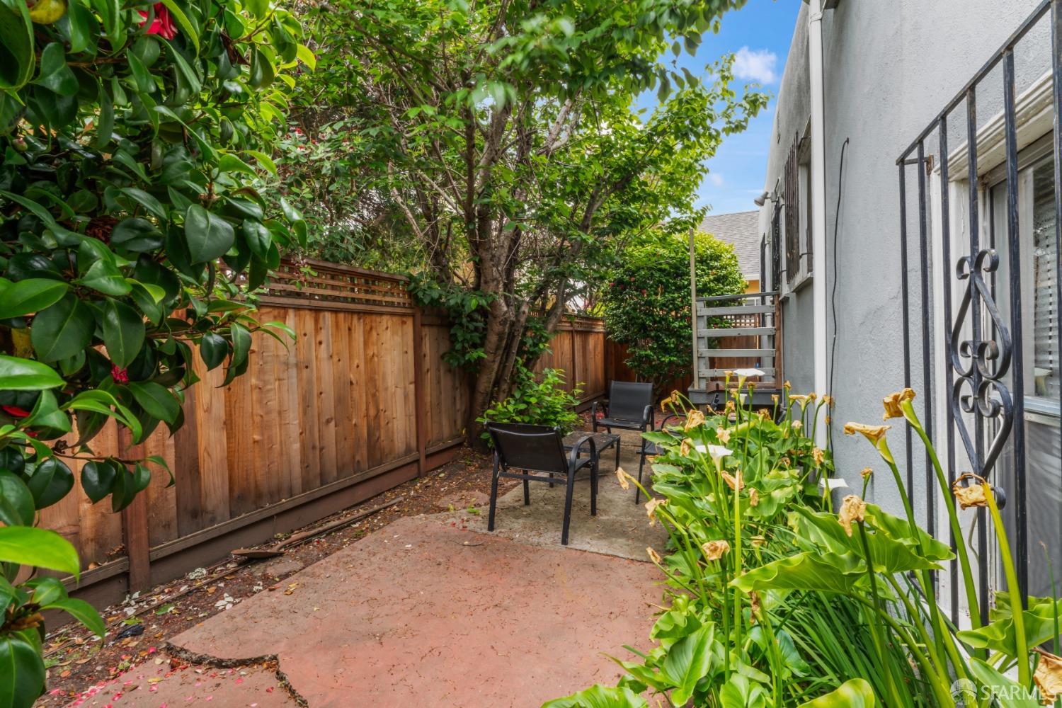 1646 Parker Street Berkeley, CA 94703 - Photo 26 of 33 a view of a chair and table in the backyard