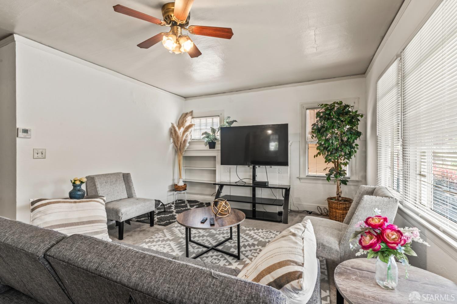 1646 Parker Street Berkeley, CA 94703 - Photo 7 of 33 a living room with furniture and a potted plant