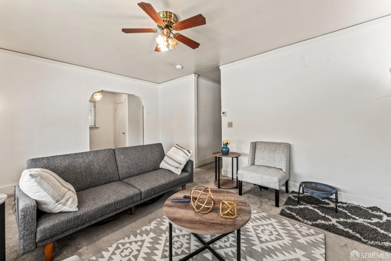 1646 Parker Street Berkeley, CA 94703 - Photo 8 of 33 a living room with furniture a rug and a chandelier