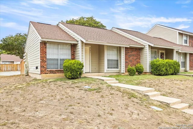a view of a house with a garden