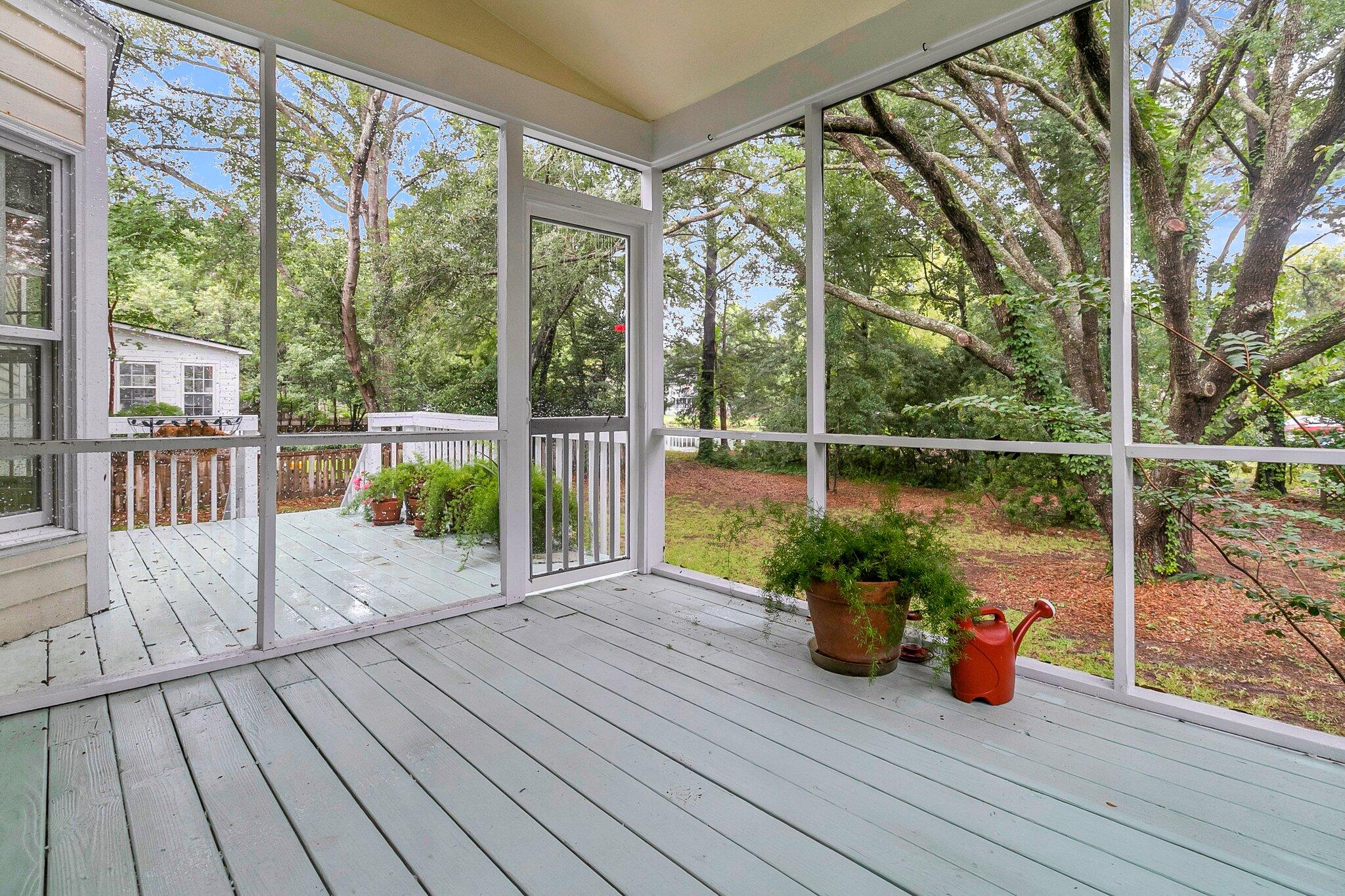 1484 Oak Landing Road Mount Pleasant, SC 29464 - Photo 19 of 28 Screened Porch with views of the Lake