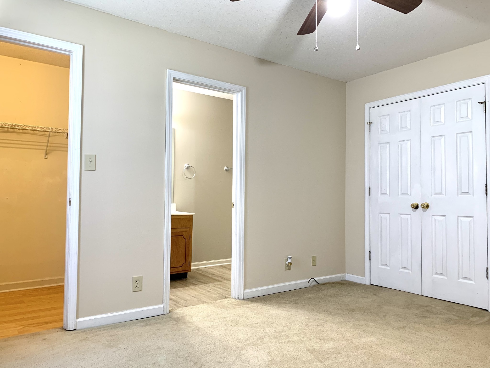 1024 Poppy Seed Drive Oak Grove, KY 42262 - Photo 17 of 21 an empty room with closet and a chandelier fan