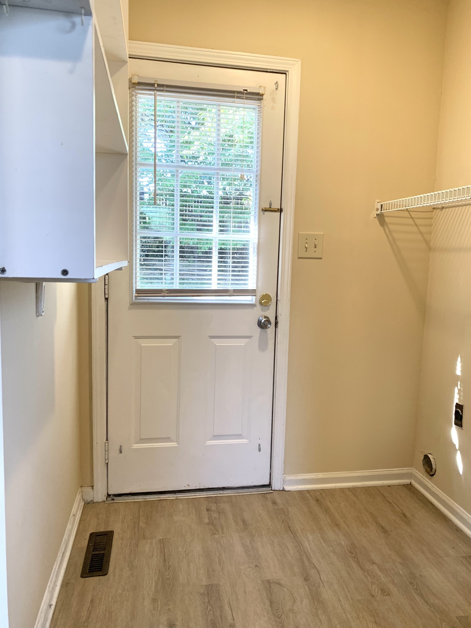 1024 Poppy Seed Drive Oak Grove, KY 42262 - Photo 6 of 21 a view of an empty room with a window and hardwood floor