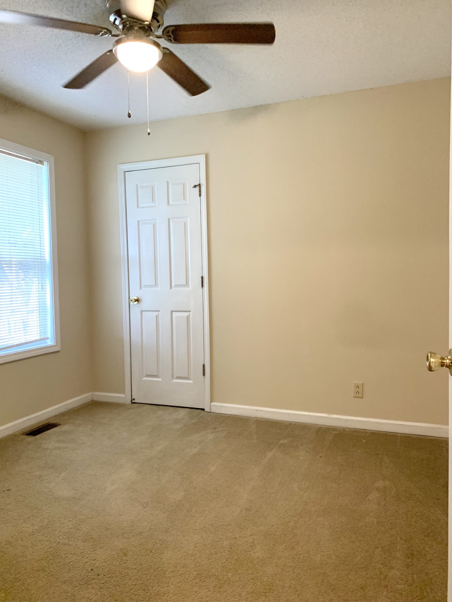 1024 Poppy Seed Drive Oak Grove, KY 42262 - Photo 7 of 21 an empty room with a window and a fan