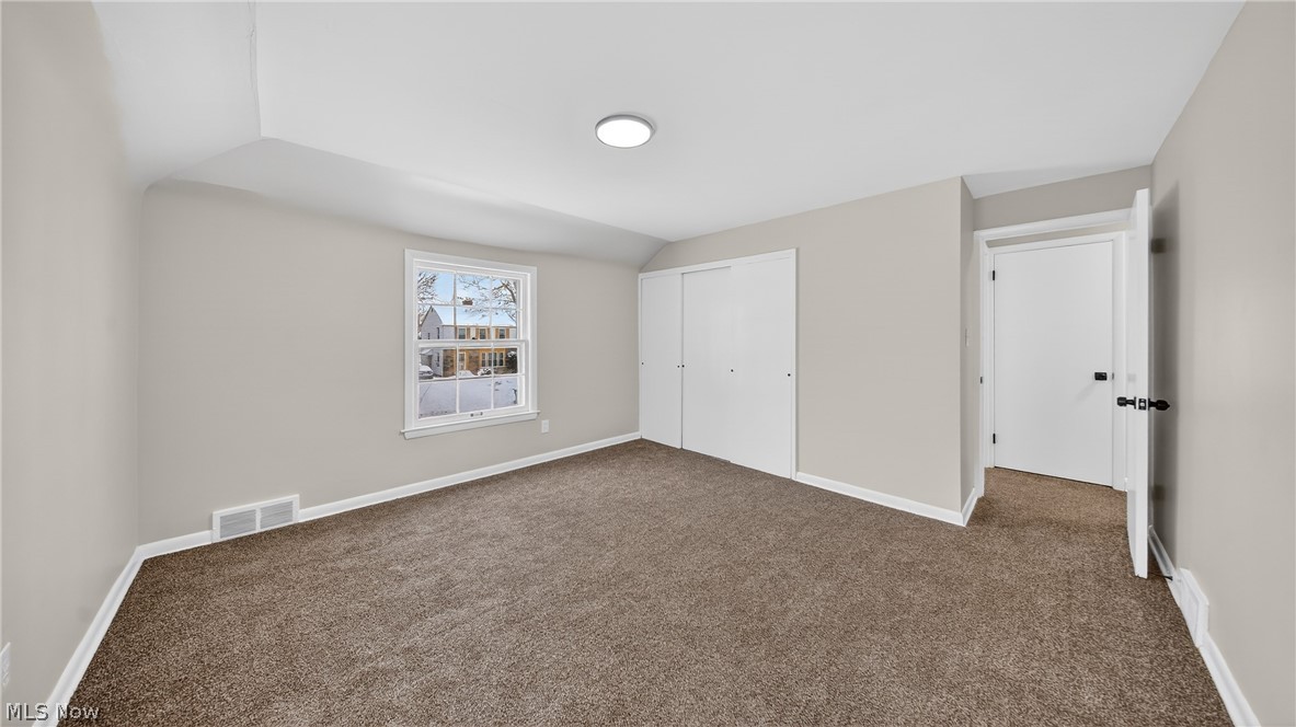 16811 Invermere Avenue Cleveland, OH 44128 - Photo 36 of 47 Unfurnished bedroom with carpet, vaulted ceiling, and a closet