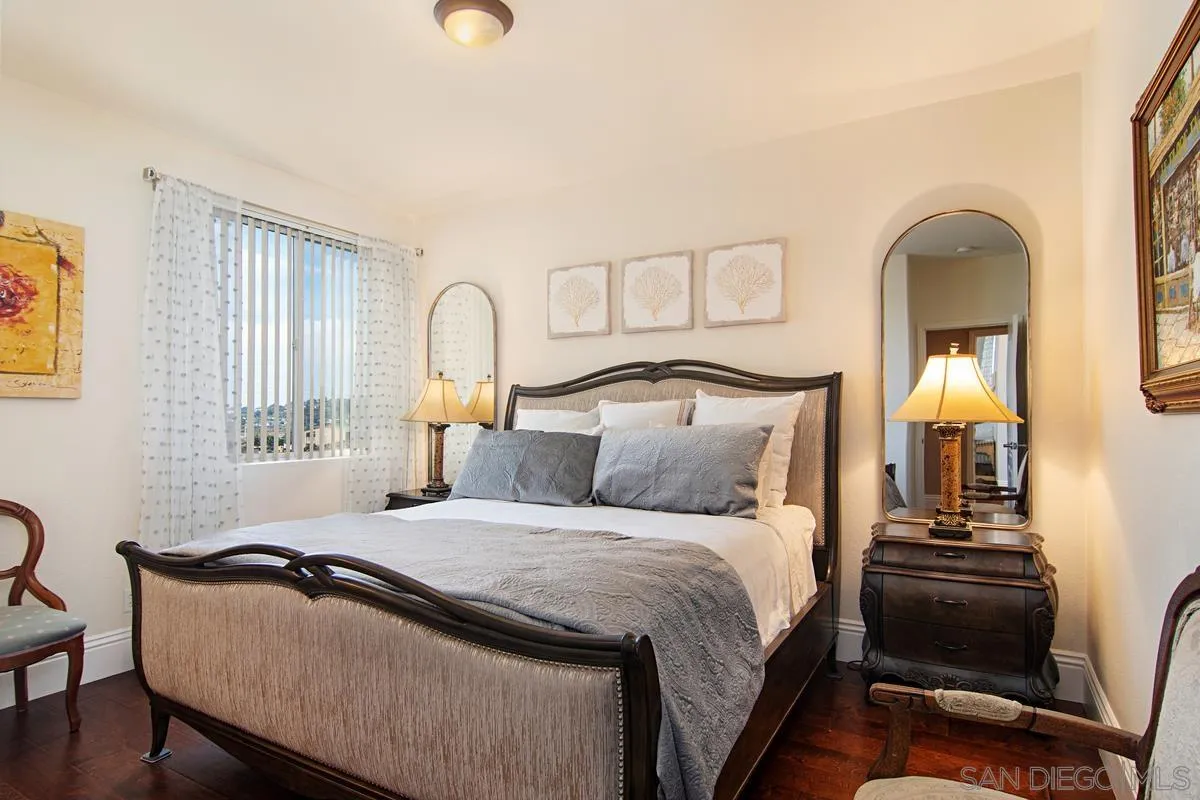 Undisclosed Address San Diego, CA 92130 - Photo 15 of 28 a bedroom with a bed and wooden floor