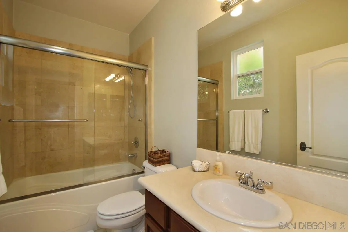 Undisclosed Address San Diego, CA 92130 - Photo 18 of 28 a bathroom with a sink a toilet and shower