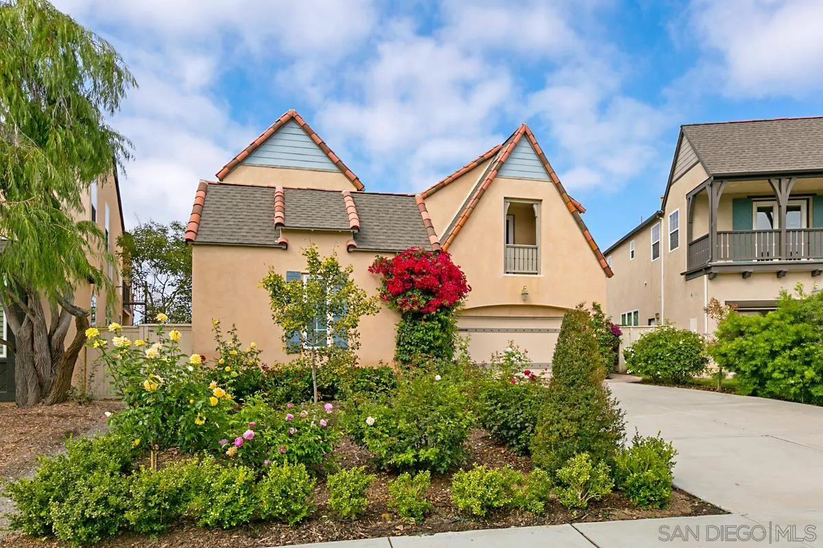 Undisclosed Address San Diego, CA 92130 - Photo 2 of 28 a front view of house with a yard and trees in the background