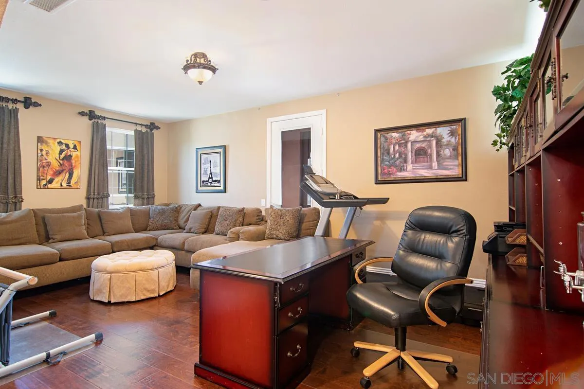 Undisclosed Address San Diego, CA 92130 - Photo 22 of 28 a living room with furniture and a flat screen tv