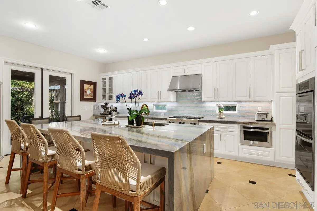 Undisclosed Address San Diego, CA 92130 - Photo 9 of 28 a kitchen with appliances a sink and cabinets