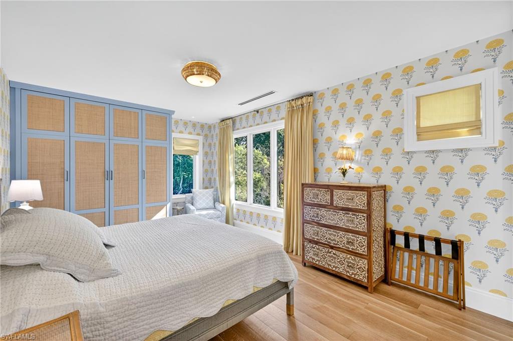111 Caribbean Road Naples, FL 34108 - Photo 35 of 50 a bedroom with a bed and a window