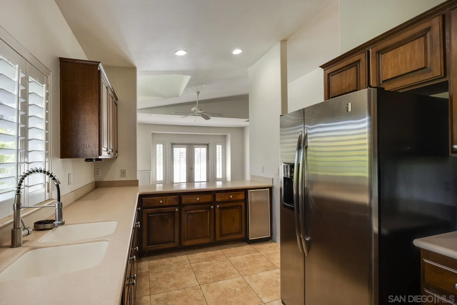 828 D Coronado, CA 92118 - Photo 11 of 24 a kitchen with stainless steel appliances granite countertop a refrigerator and a sink