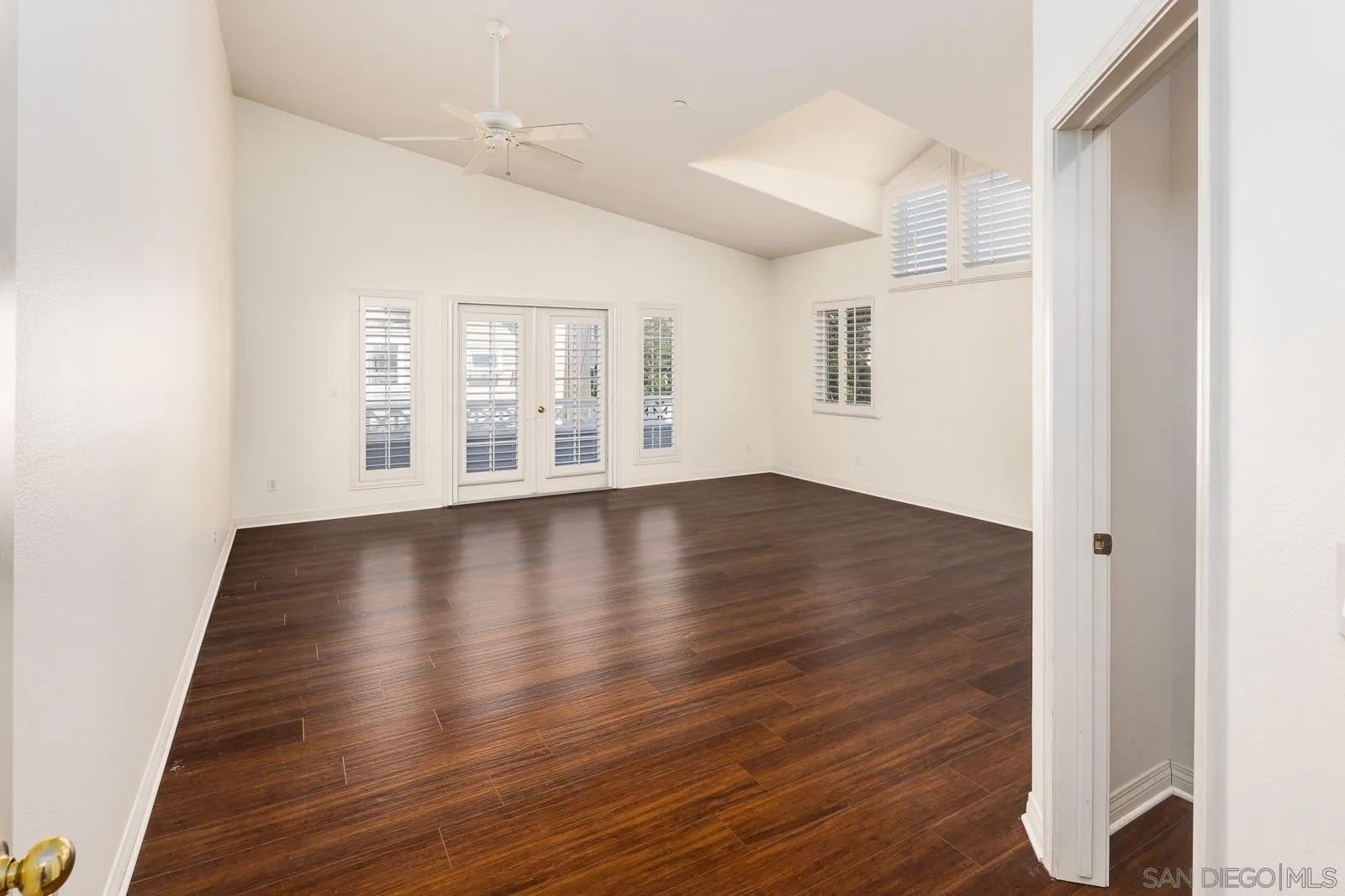 828 D Coronado, CA 92118 - Photo 14 of 24 a view of an empty room with wooden floor and a window