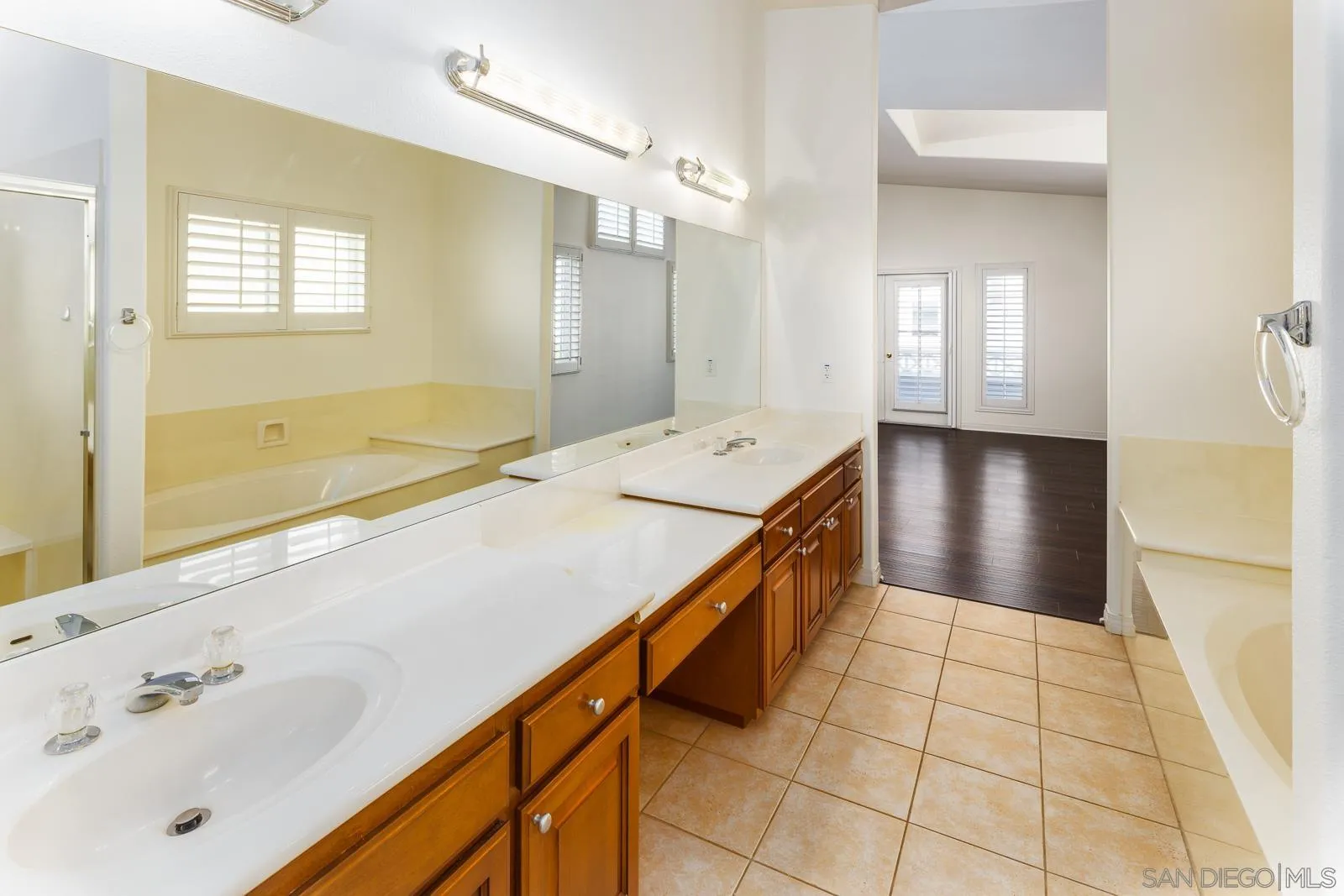 828 D Coronado, CA 92118 - Photo 16 of 24 a spacious bathroom with a tub sink and mirror