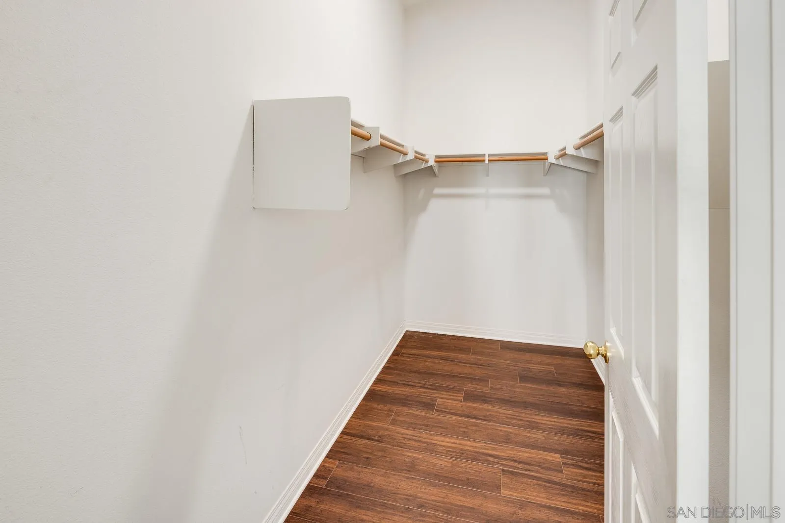 828 D Coronado, CA 92118 - Photo 17 of 24 a view of a hallway with wooden floor and entryway