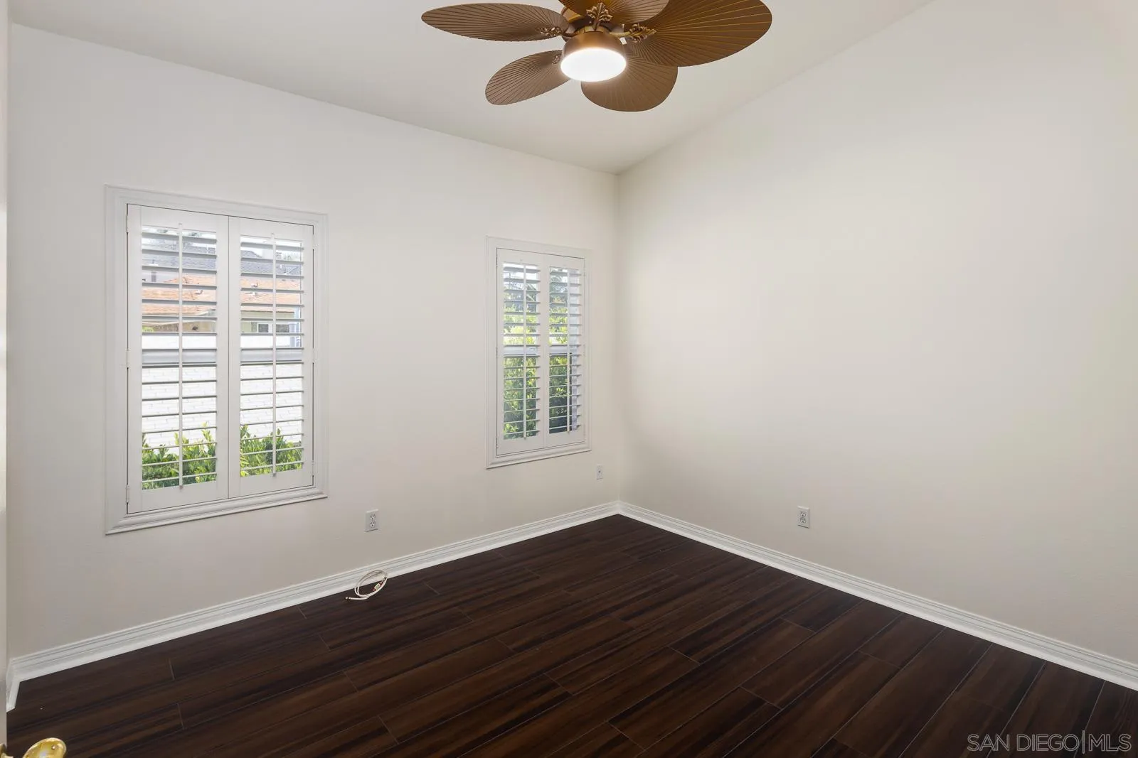 828 D Coronado, CA 92118 - Photo 18 of 24 a view of an empty room with wooden floor and a window